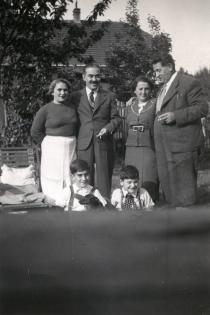 Harry Fink and his parents with friends of the family