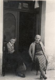 Irma Weissova in the front of her house
