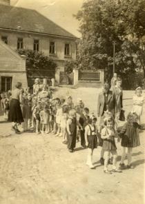Vera Sestakova with nursery school children on a trip